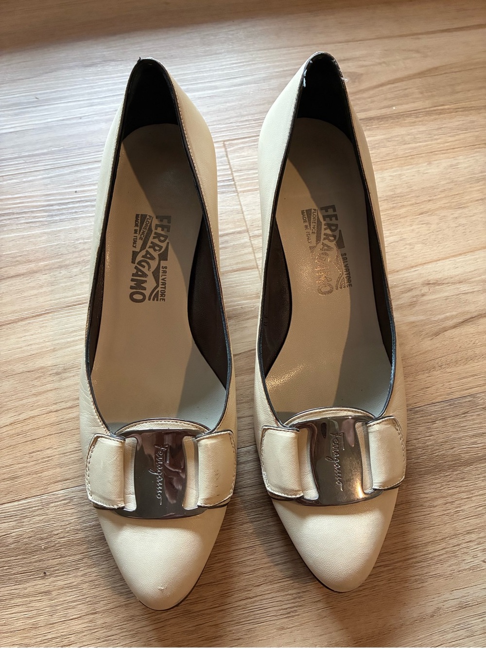 Salvatore Ferragamo Cream Pointed Pumps with Silver Logo Plaque